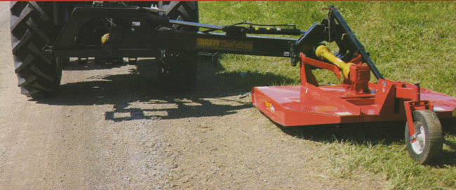 Mower deck rotated in normal horizontal mowing position, pendular mounting bracket at offset arm allows 55 degree rotation of mower deck in this position to follow the ground contours when mowing hills and ditches